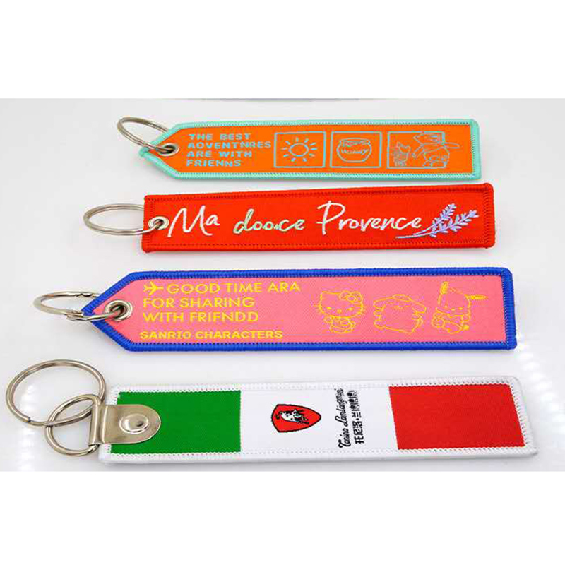 	Porte-clés tissé personnalisé avec logo – objet publicitaire textile original